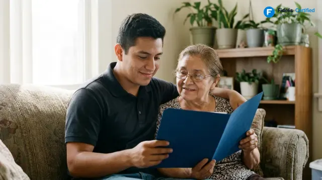 A family from Honduras reviewing their certified translation in a Fidelis blue folder